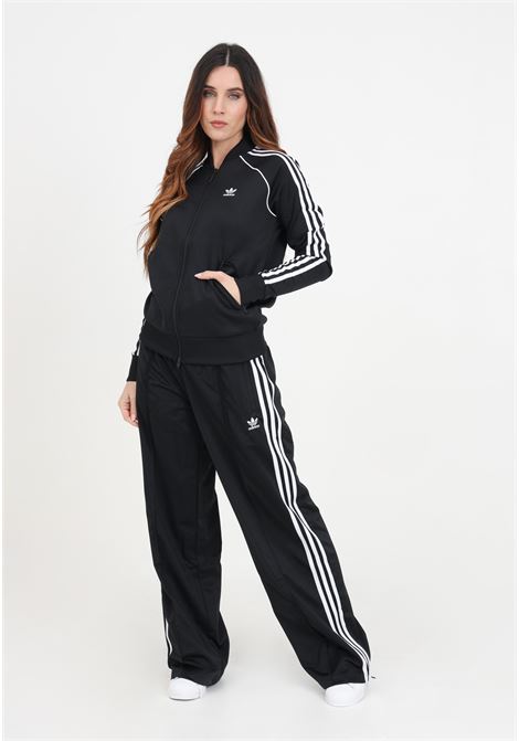 Firebird Loose black women's joggers with vertical stripes ADIDAS ORIGINALS | IT7404.